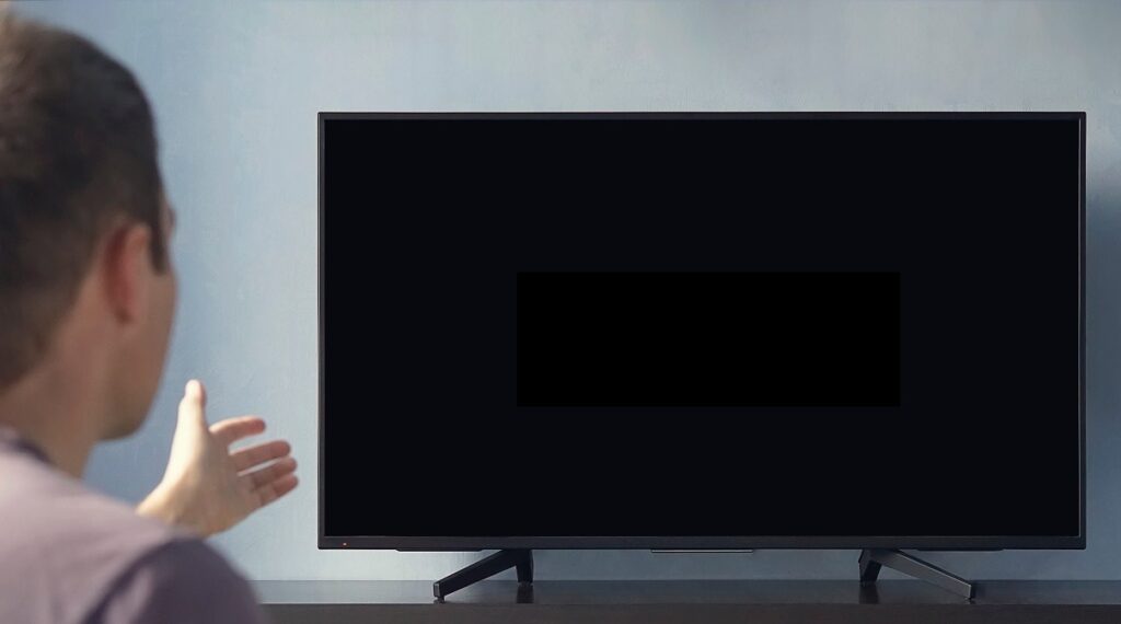 What does it mean when your TV turns on but the screen is black?